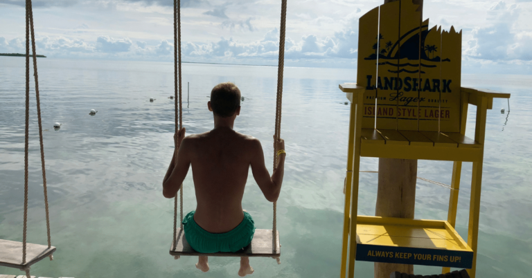 Chair over the water at bar in Caye Caulker