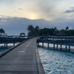 W Maldives jetty from overwater bungalows to beach.