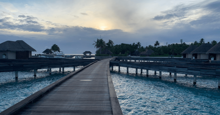 W Maldives jetty from overwater bungalows to beach.