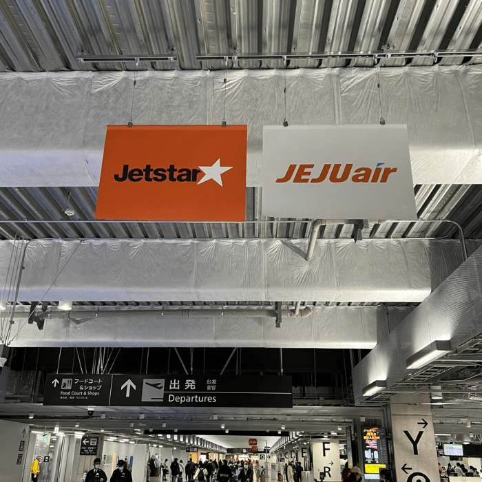 Jeju Air and Jet Star banners check in area at Narita International Airport